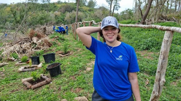 Young woman clearing vegetation