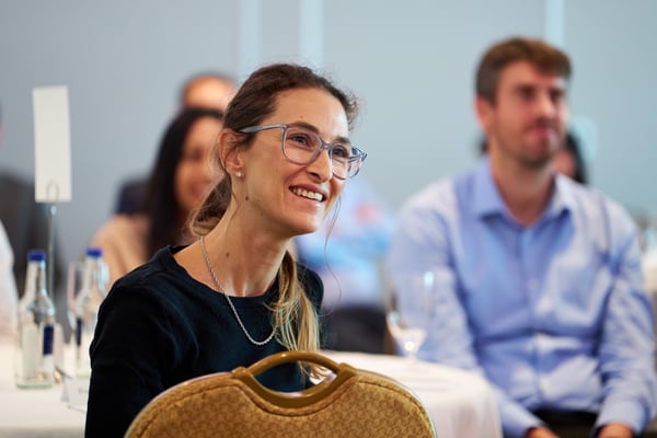 People sitting in the audience of a conference